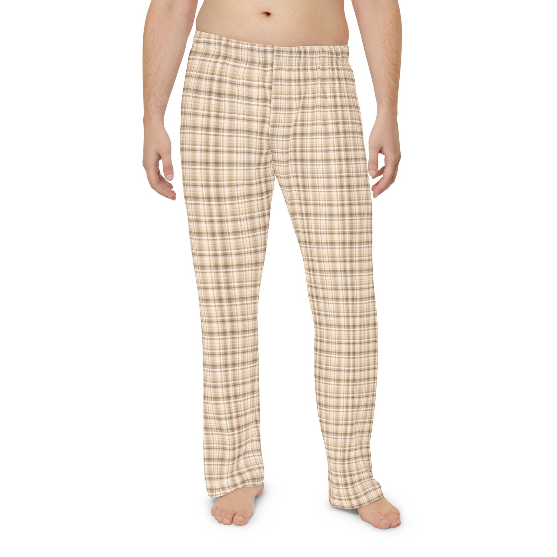 Plaid pajama pants worn by a person on a white background