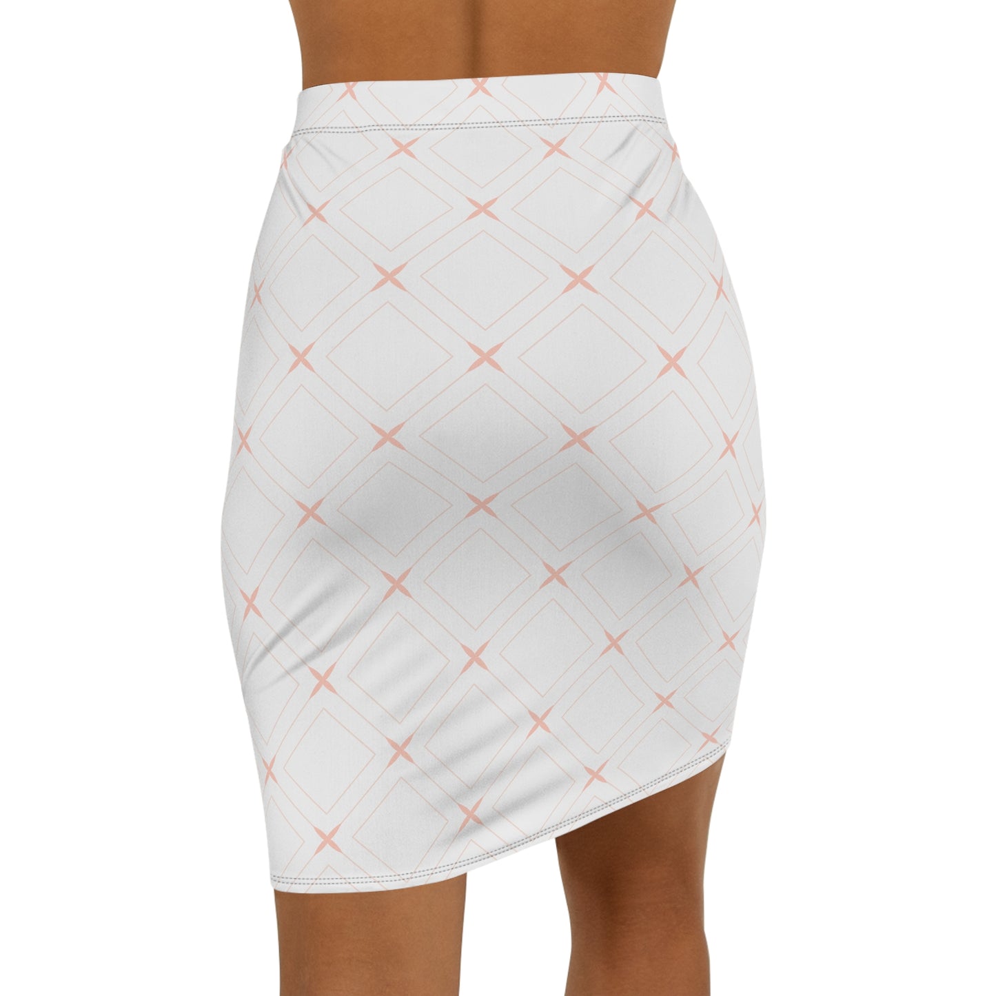 White skirt with pink cross pattern worn by a person on a white background