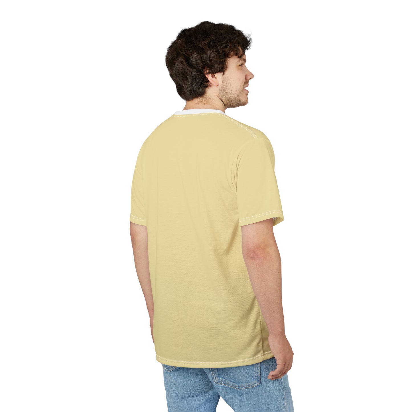 Man wearing a light yellow t-shirt and blue jeans on a white background