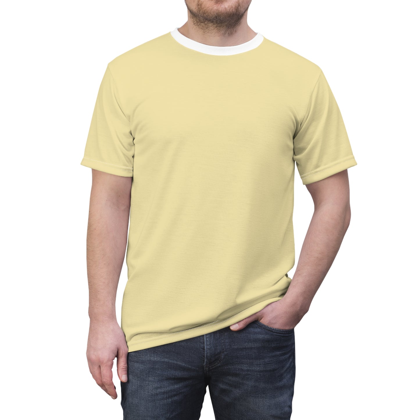 Person wearing a light yellow t-shirt and dark jeans on a white background