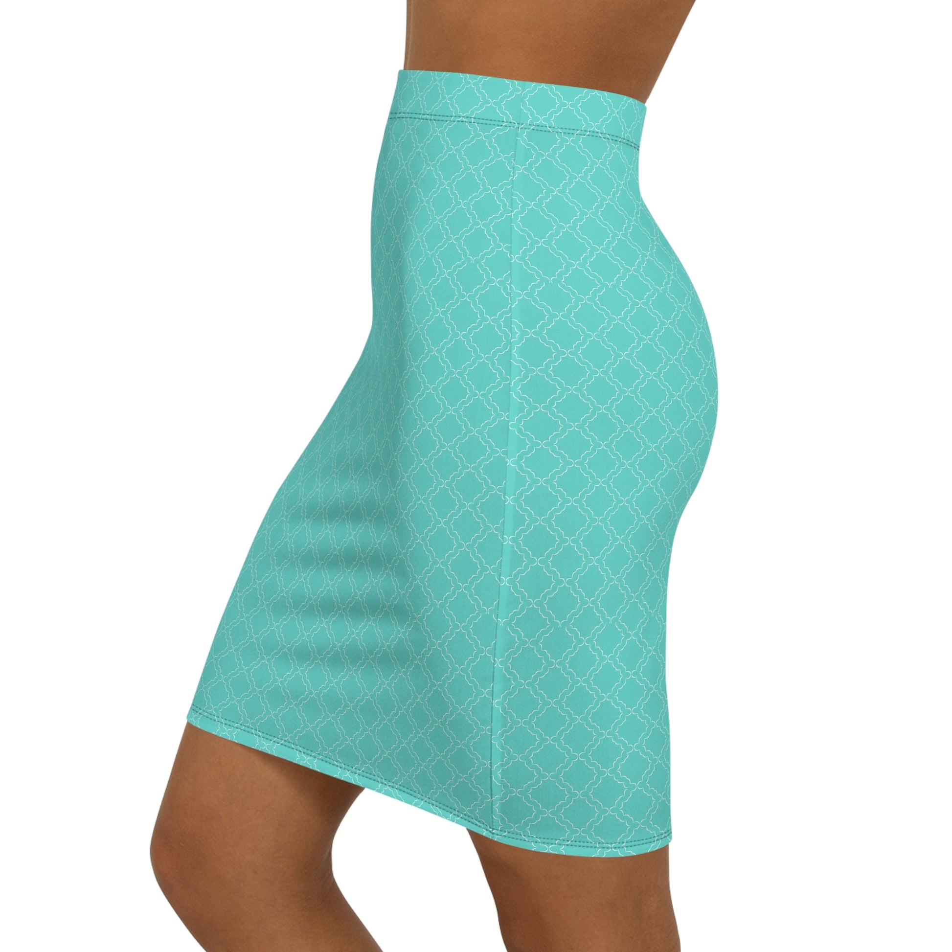 Teal patterned skirt worn by a person on a white background
