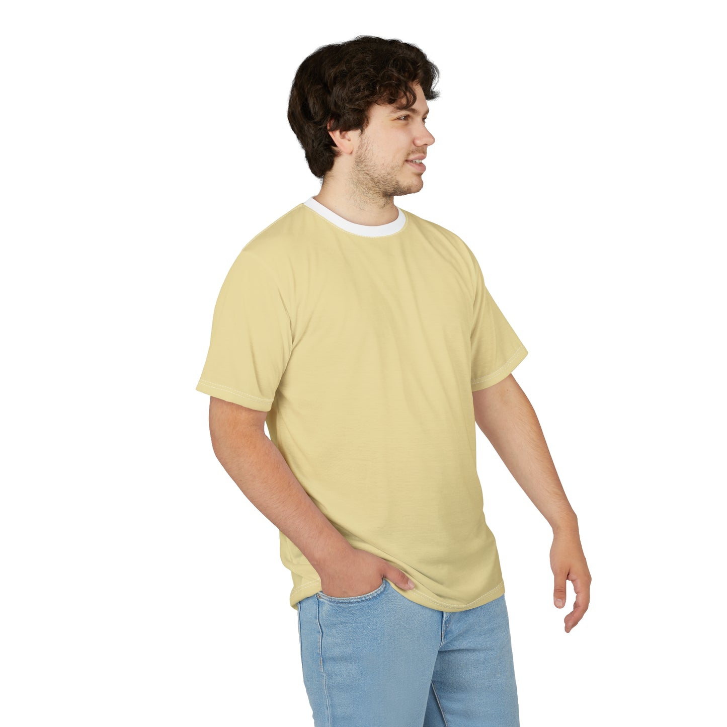 Man wearing a light yellow t-shirt and blue jeans on a white background