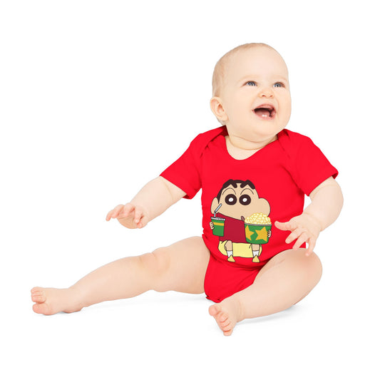 Baby wearing a red onesie with a cartoon character on a white background
