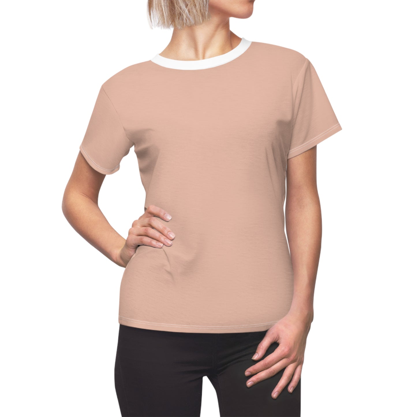 Beige t-shirt worn by a person on a white background