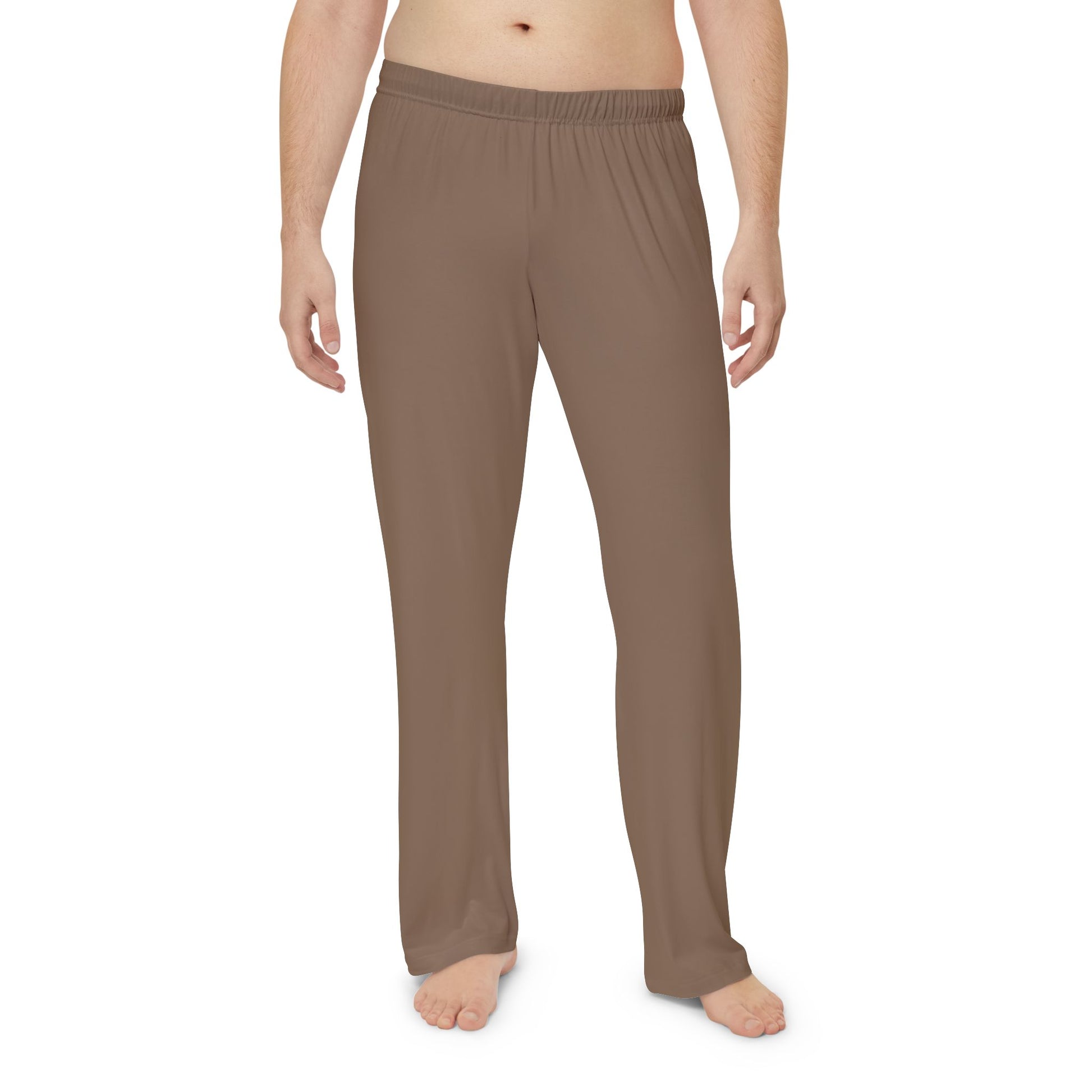 Brown lounge pants worn by a person on a white background