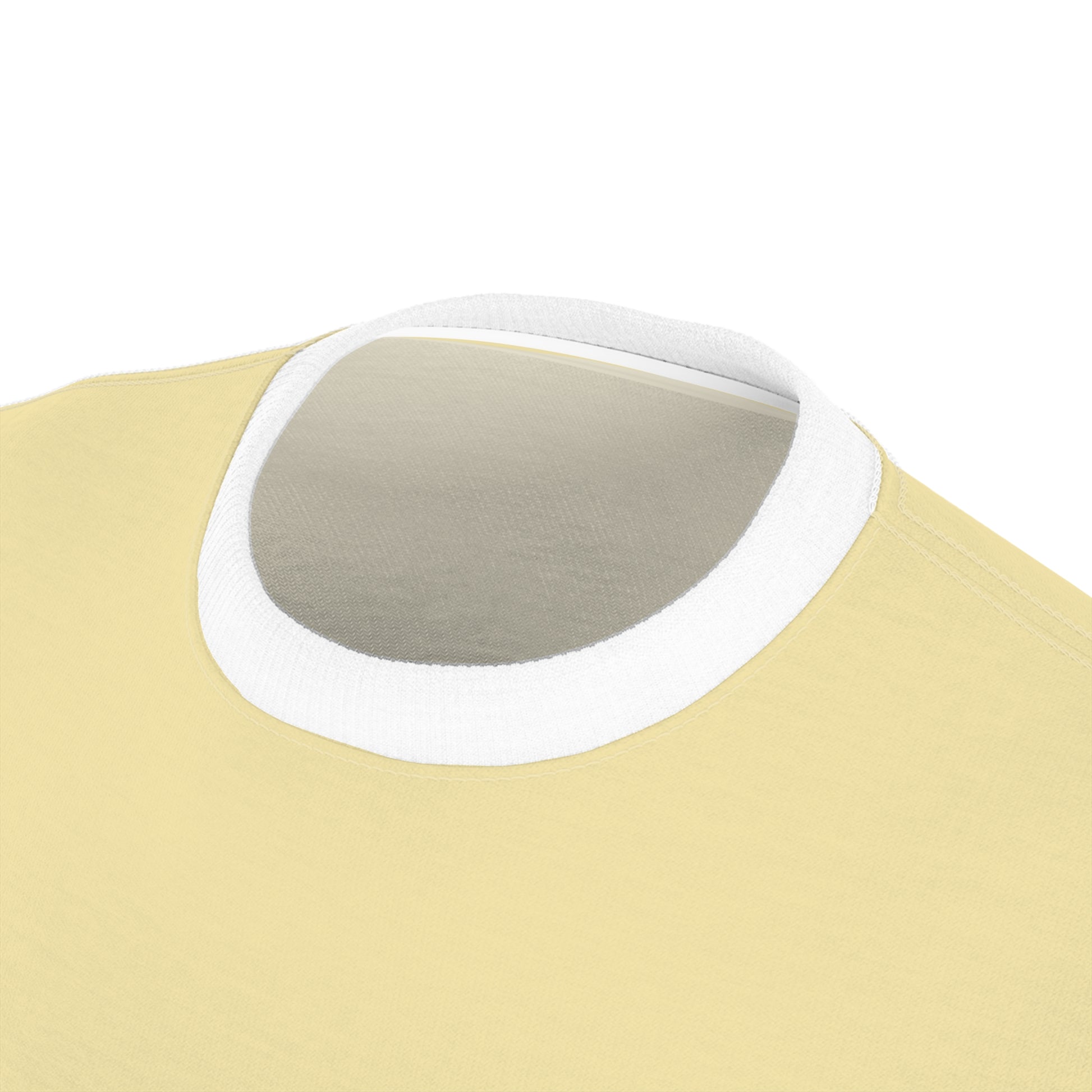 Close-up of a yellow garment with a white neckline on a white background