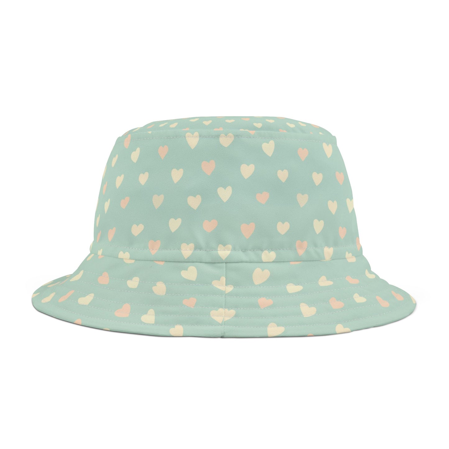 Bucket hat with heart pattern on a light green background