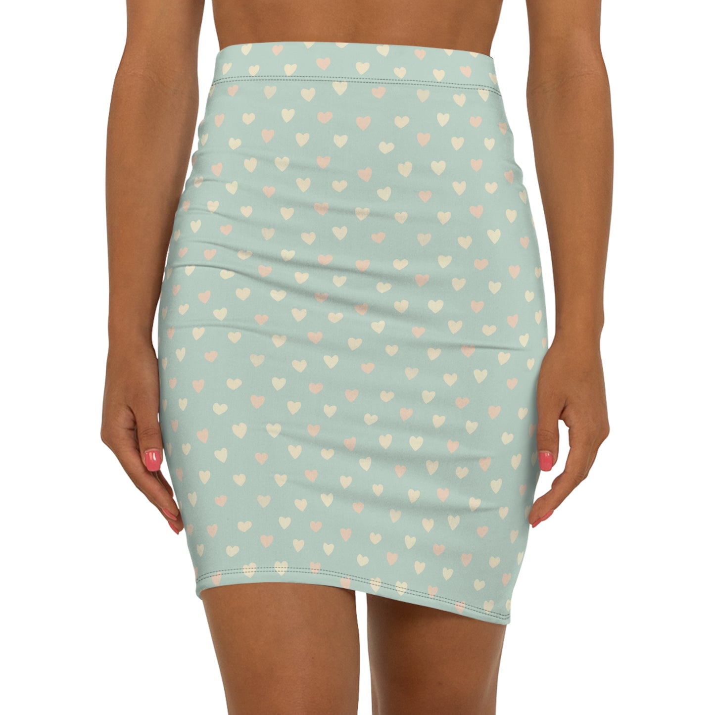Light blue skirt with heart pattern worn by a person on a white background